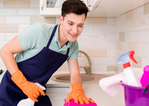 A professional cleaning team polishes windows and vacuums plush carpets in a spotless, modern office with glass, metal, and wooden surfaces, illuminated by natural light streaming through floor-to-ceiling windows. Captured with a Nikon D850 camera, the image highlights a sleek, dynamic corporate environment.